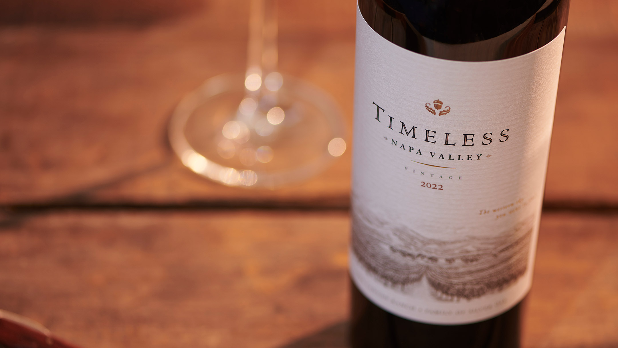 2022 Timeless Napa Valley Red Wine bottle on table with a wine glass